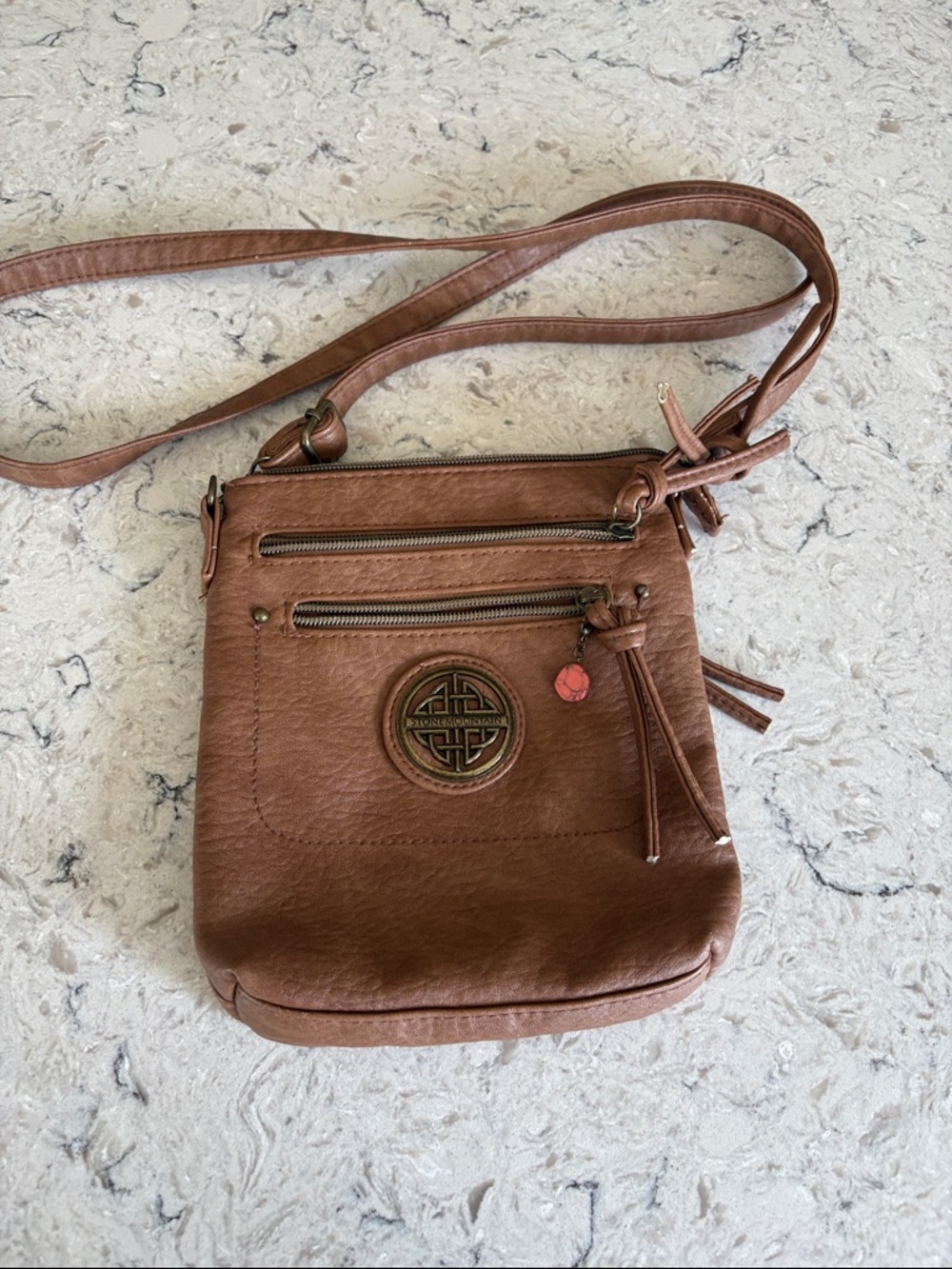 Stone Mountain Accessories Tan Faux-Leather Crossbody with Tassel Accent